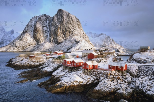 Famous tourist attraction Hamnoy fishing village on Lofoten Islands, Norway with red rorbu houses in winter