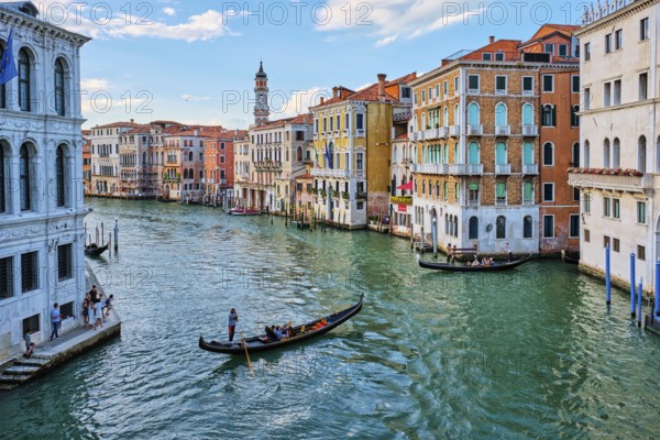 VENICE, ITALY, JUNE 27, 2018: Grand Canal with boats and gondolas on sunset, Venice, Italy, Europe