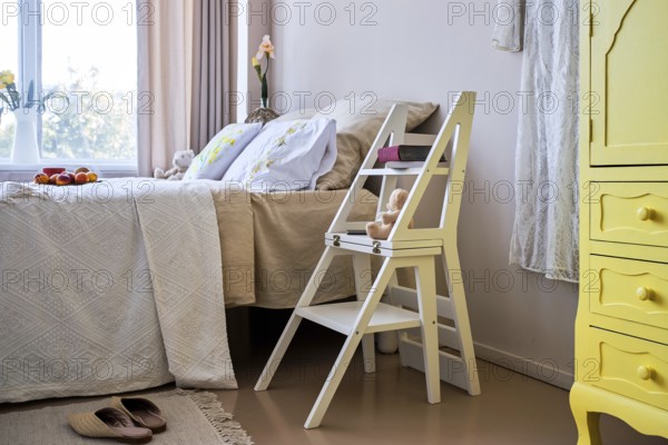 Use of folding stepladder chair in bedroom