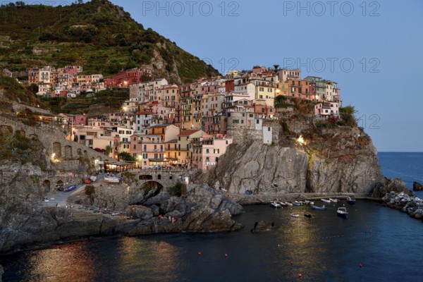 Fishing village of Manarola, blue hour, district of Riomaggiore, Cinque Terre, province of La Spezia, Liguria, Italy, Europe