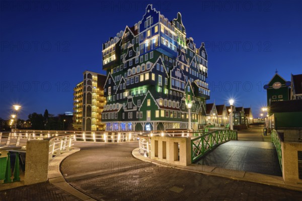 ZAANDAM, NETHERLANDS, MAY 8, 2017: Inntel Hotel in Zaandam illuminated at night. Design of 12-storey tall building opened in 2009 is the result of stacking a series of traditional Dutch houses