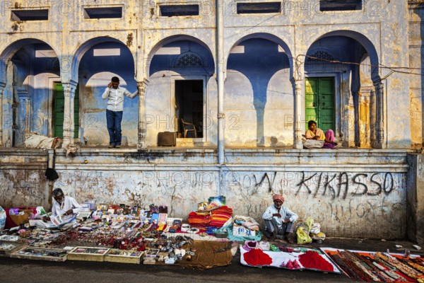 PUSHKAR, INDIA, NOVEMBER 21, 2012: Indian street vendors in Pushkar town street. Pushkar, Rajasthan, India, Asia