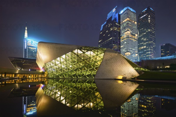 GUANGZHOU, CHINA, APRIL 27, 2018: Guangzhou Opera House designed by famous Iraqi architect architect Zaha Hadid illluminated at night