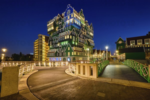 ZAANDAM, NETHERLANDS, MAY 8, 2017: Inntel Hotel in Zaandam illuminated at night. Design of 12-storey tall building opened in 2009 is the result of stacking a series of traditional Dutch houses