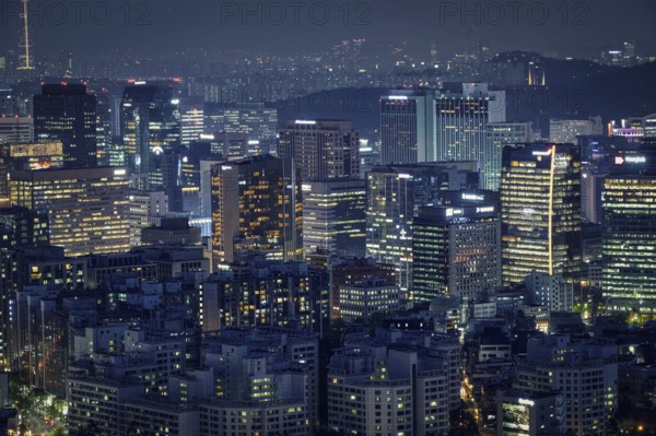 Seoul skyscrapers illuminated with lights view from Inwang mountain. Seoul, South Korea, Asia