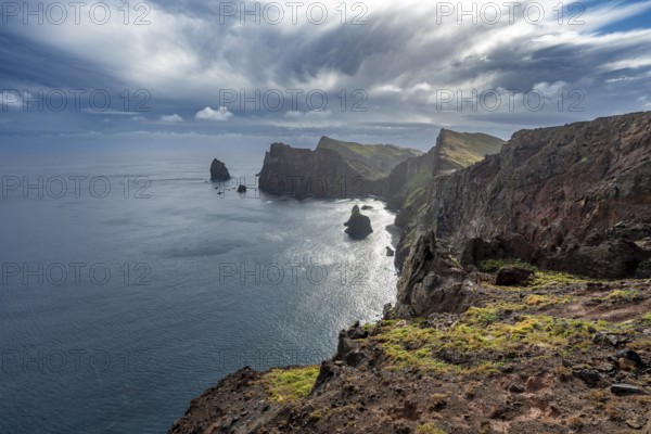 Red cliffs and rocks in the sea, coastal landscape with dramatic sky, Ponta de São Lourenço, volcanic peninsula São Lourenço, Ponta de San Lorenzo, Madeira, Portugal, Europe