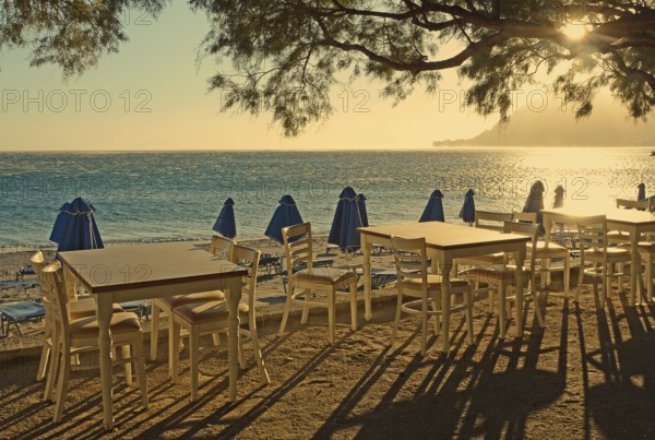 Gastronomy, tables and chairs on the beach, Plakias, Crete, Greece, Europe
