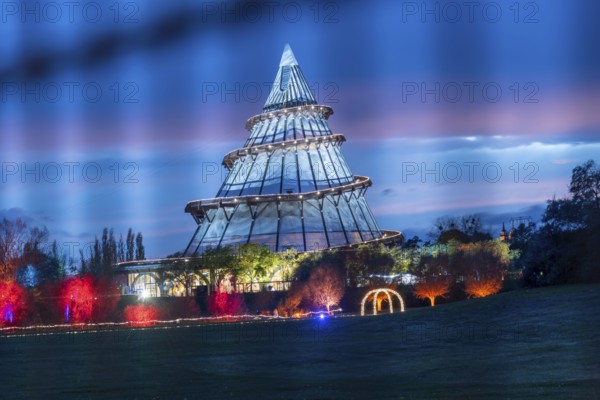 Red band of clouds passes the illuminated millennium tower in the Elbauenpark, landmark, Magdeburg, Saxony-Anhalt, Germany, Europe