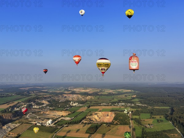 Many different hot-air balloons travelling in the blue sky, advertising, logo, hot-air balloon festival, 26th Warsteiner International Montgolfiade, aerial photo, Warstein, Sauerland, North Rhine-Westphalia, Germany, Europe
