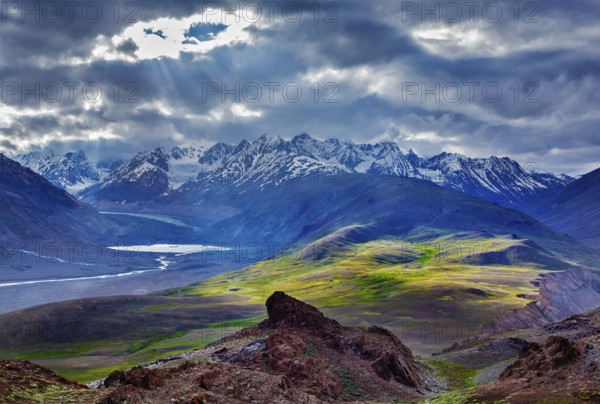 Himalayan landscape near Chandra Tal lake with sun rays coming through clouds. Himachal Pradesh, India Spiti Valley, Himachal Pradesh, India, Asia