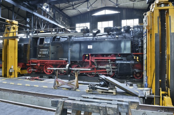 Steam locomotive of the Harz narrow gauge railway for maintenance in the workshop, Wernigerode, Saxony-Anhalt, Germany, Europe
