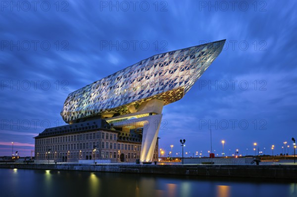 ANTWERP, BELGIUM, MAY 27, 2018: Port authority house (Porthuis) designed by famous Zaha Hadid Architects which was her last project illuminated in the night