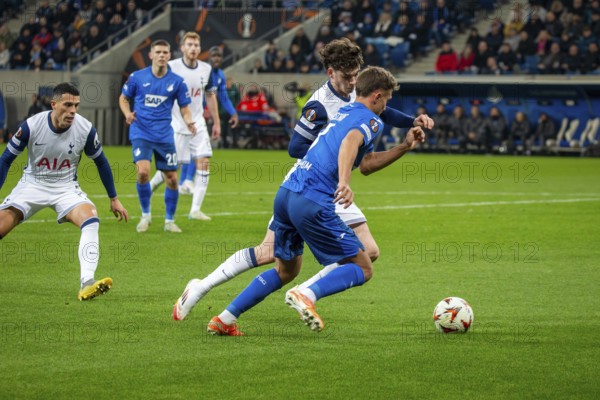 Football UEFA Europa League, 2024/25 season, matchday 7: TSG Hoffenheim v Tottenham Hotspur. Picture: Duel between Tom Bischof (7, Hoffenheim) and Archie Gray (14, Tottenham)