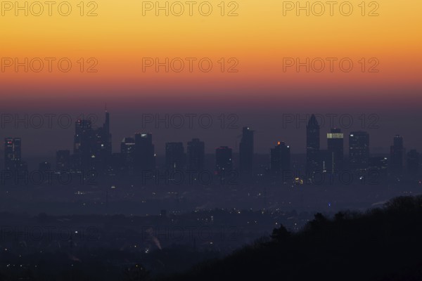 Shortly in front of sunrise, the sky behind the Frankfurt banking skyline turns yellow and orange, Frankfurt am Main, Kronberg Malerblick, Hesse, Germany, Europe