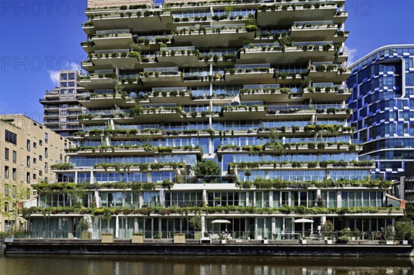 Left residential building The George, architects dok, right office building NautaDutilh by architects UN studio, Zuidas financial district, Amsterdam, North Holland, Netherlands