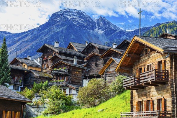Old wooden houses in the historic village centre, behind the summit of the Scex Marenda mountain, Grimentz, Val d'Anniviers, Valais Alps, Canton Valais, Switzerland, Europe