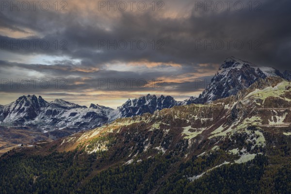 Dark clouds at sunset, snow-covered mountains above Saint Luc, Val d'Anniviers, Valais Alps, Canton Valais, Switzerland, Europe
