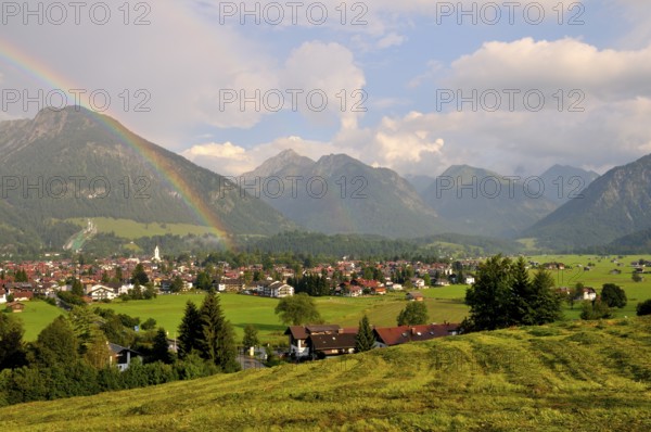 View over Oberstdorf with rainbow and Allgäu Alps, Oberallgäu, Bavaria, Germany, Europe