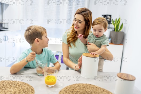 Caucasian family of a single mother with two kids having breakfast before going to school