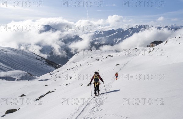 Ski tourers in a wintry mountain landscape, Bündner Haute Route ski tour, Albula Alps, Rhaetian Alps, Grisons, Eastern Switzerland, Switzerland, Europe
