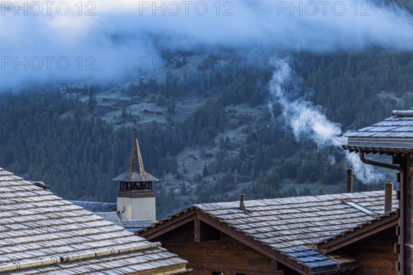 Roofs covered with hoarfrost, fog rising, Grimentz, Val d'Anniviers, Valais Alps, Canton Valais, Switzerland, Europe