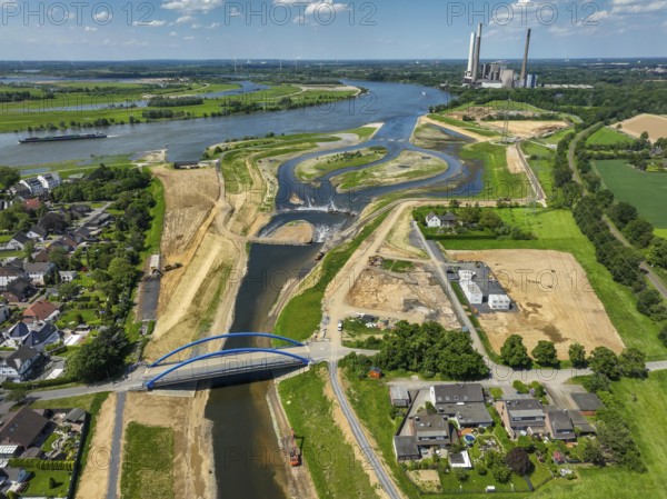 Dinslaken, Voerde, North Rhine-Westphalia, Germany, Renaturalisation of the Emscher. New Emscher estuary into the Rhine. Flood protection through land expansion. The decommissioned STEAG coal-fired power station in Voerde in the background. The mouth of the Emscher into the Rhine was moved from Dinslaken to Voerde, almost 500 metres to the north. Fish can now swim barrier-free up the new Emscher from the Rhine through a newly created floodplain area. Following the construction of a parallel sewer, the Emscher has been completely free of sewage since January 2022. The river was previously an open, above-ground combined sewer with rainwater and wastewater, Europe