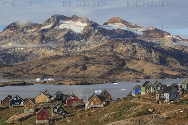 Inuit settlement at a fjord with icebergs, mountainous, autumn, sunny, Tasiilaq, East Greenland, Greenland, North America