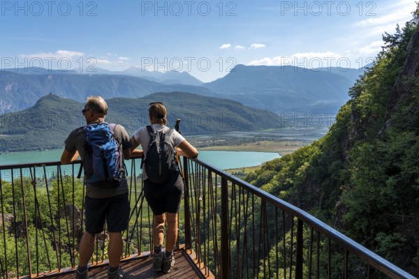 View from the hiking trail of the Rastenbach gorge to Lake Kaltern, near the village of Kaltern, in the Adige Valley in South Tyrol, one of the two warmest lakes in the Alps, bathing lake, surrounded by vineyards and apple orchards, Italy, Europe