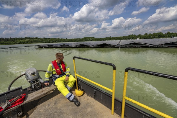 Germany's largest floating solar power plant on the Silbersee III, a quarry pond no longer used for sand mining, near Haltern am See, operated by Quarzwerke GmbH, around 5800 solar modules, on an area of a good 2 football pitches, generate 3.1 megawatts of power, the company uses the electricity itself on weekdays, at weekends it flows into the public grid, North Rhine-Westphalia, Germany, Europe