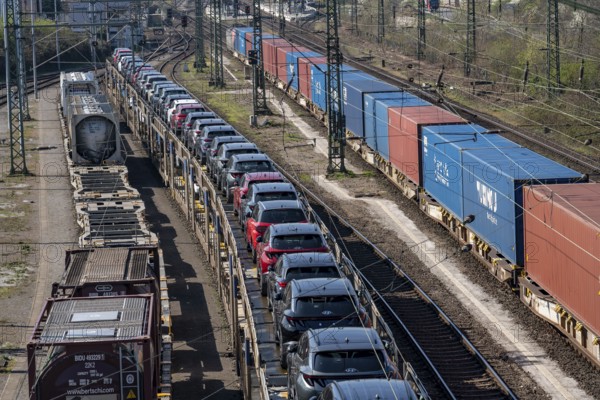 Duisburg-Rheinhausen freight station, at the Logport harbour area, goods trains loaded with new cars, various tank containers and the container train from China, on its way to the Logport, part of the new Silk Road, Duisburg, North Rhine-Westphalia, Germany, Europe