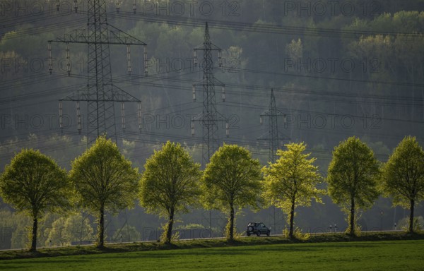 Traffic on the B59 motorway near Grevenbroich, avenue, high-voltage pylons, Germany, Europe