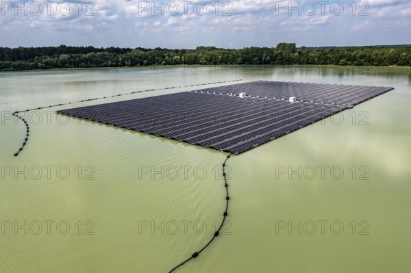 Germany's largest floating solar power plant on the Silbersee III, a quarry pond no longer used for sand mining, near Haltern am See, operated by Quarzwerke GmbH, around 5800 solar modules, on an area of a good 2 football pitches, generate 3.1 megawatts of power, the company uses the electricity itself on weekdays, at weekends it flows into the public grid, North Rhine-Westphalia, Germany, Europe