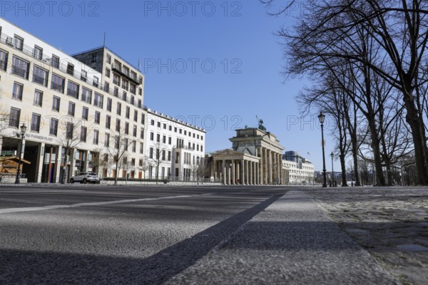The Brandenburg Gate in Berlin. Where many hundreds of people usually linger to visit the government district, there is now an eerie silence. Public life in Berlin has almost come to a standstill following the protective measures recently adopted to prevent the spread of the coronavirus. All sights, museums, squares, streets, restaurants, universities, 23.03.2020 are affected