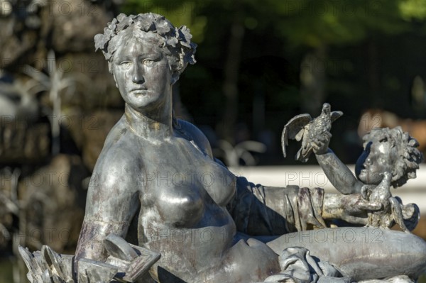 Mythological female figure at the edge of the Fama Fountain, Fama Fountain, fountain, fountain, water parterre, New Herrenchiemsee Palace, palace park, Herreninsel, Chiemsee, Chiemgau, Upper Bavaria, Bavaria, Germany, Europe