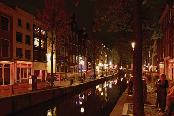 Night shot of the Oudezijds Achterburgwal in the red light district in Amsterdam, North Holland, Netherlands