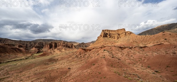 Eroded mountain landscape with sandstone cliffs, red and orange rock formations, Konorchek Canyon, Chuy, Kyrgyzstan, Asia