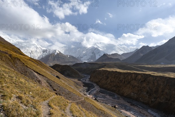 Valley with river Achik Tash between high mountains, mountain landscape with glaciated peak Pik Lenin, Trans Alay Mountains, Pamir Mountains, Osh Province, Kyrgyzstan, Asia