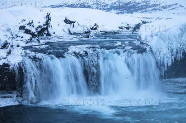 Godafoss waterfall, icy and snowy rock face, snowy landscape, Northern Iceland Eyestra, Iceland, Europe