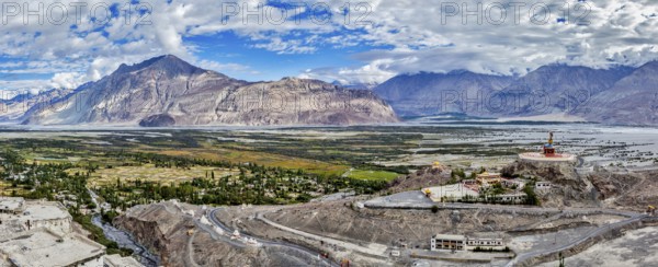 Panorama of Nubra valley in Himalayas with giant Buddha statue in Diskit, Ladakh, India, Asia