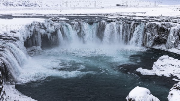 Godafoss waterfall, icy and snowy rock face, snowy landscape, Northern Iceland Eyestra, Iceland, Europe