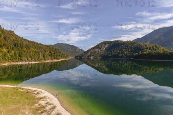 Intake structure at the Sylvenstein reservoir is used for flood protection, dams the Isar, power station, power generation, forest, water reflection, blue sky