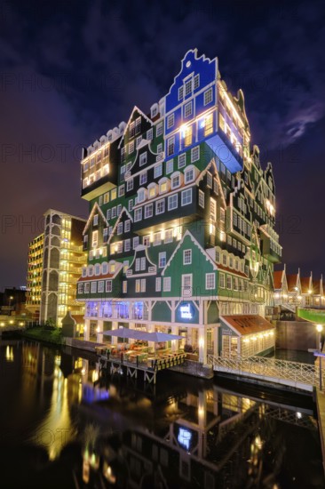 ZAANDAM, NETHERLANDS, MAY 21, 2018: Inntel Hotel in Zaandam illuminated at night. Design of 12-storey tall building opened in 2009 is the result of stacking a series of traditional Dutch houses