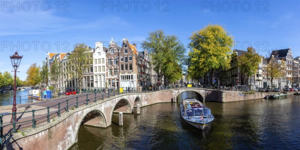 Canals and bridges building panorama at the Keizersgracht in the city of Amsterdam, Netherlands