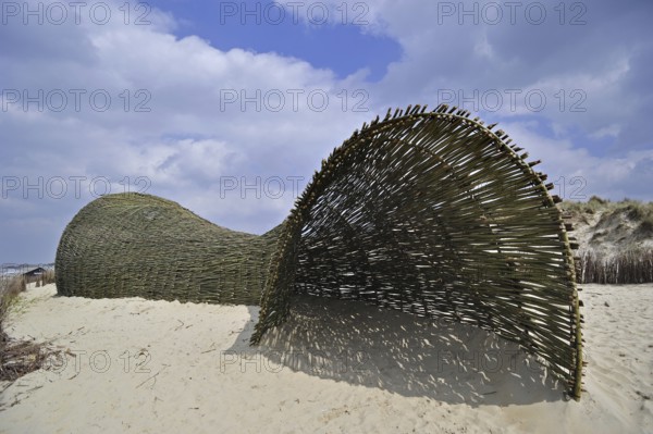 Sandworm by artist Marco Casagrande in the dunes during Beaufort04 at De Haan, Wenduine, Belgium, Europe