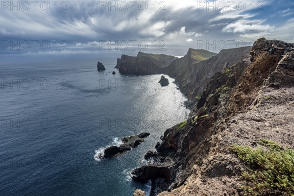 Red cliffs and rocks in the sea, coastal landscape with dramatic sky, Ponta de São Lourenço, volcanic peninsula São Lourenço, Ponta de San Lorenzo, Madeira, Portugal, Europe