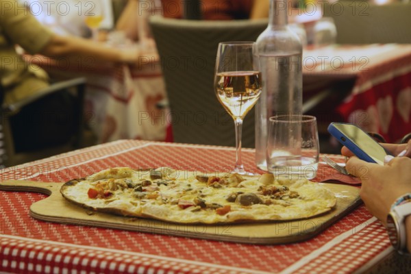 Alsatian tarte flambée in a street café in the historic centre of Strasbourg