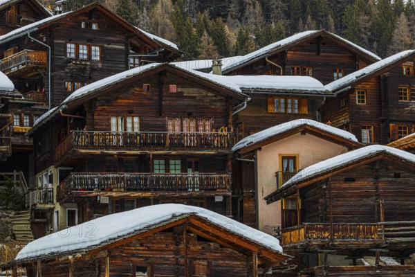 Old wooden houses with snow-covered roofs in the historic village centre, Grimentz, Val d'Anniviers, Valais Alps, Canton Valais, Switzerland, Europe