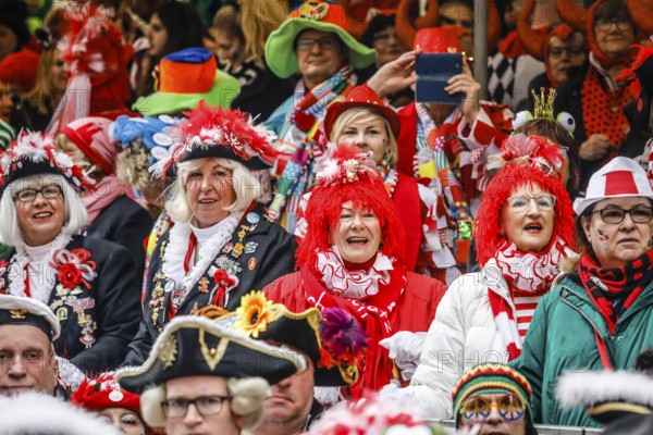 Colourfully costumed carnivalists celebrate carnival in Cologne, on Weiberfastnacht the street carnival is traditionally opened on the Alter Markt, which then reaches its climax on Rosenmontag, Cologne, Rhineland, North Rhine-Westphalia, Germany, Europe