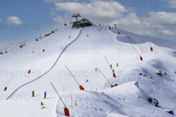 Skiers in the ski area at the summit of Corne de Sorebois, Val d'Anniviers, Valais Alps, Canton Valais, Switzerland, Europe