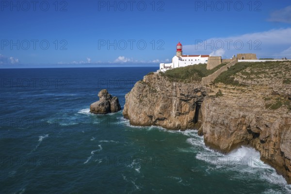 Sagres, Algarve, Portugal - Lighthouse at the Cap de Sao Vicente. Historical sight. Rocky headland with a lighthouse, considered the most south-westerly point in Portugal